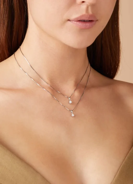 Witgouden hanger, 0.16 ct diamant, Hearts & Arrows